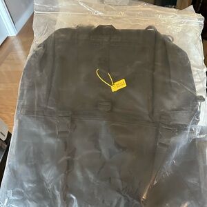Black Backpack with Yellow Tag
